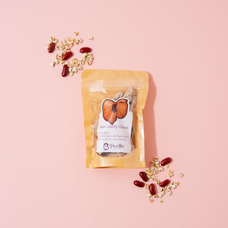 Packaged chewable supplement with scattered capsules on a pink background