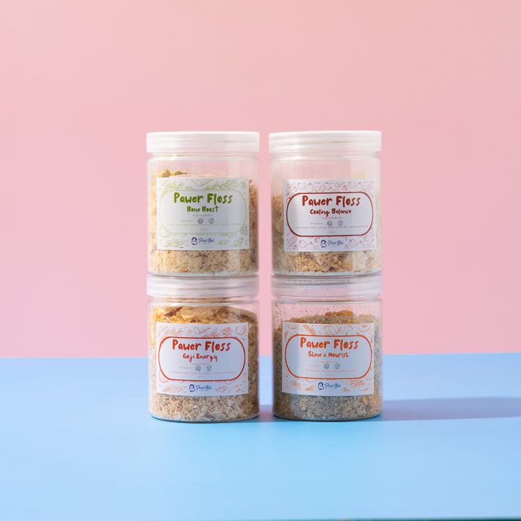 Four jars of Power Floss on a pink and blue gradient background